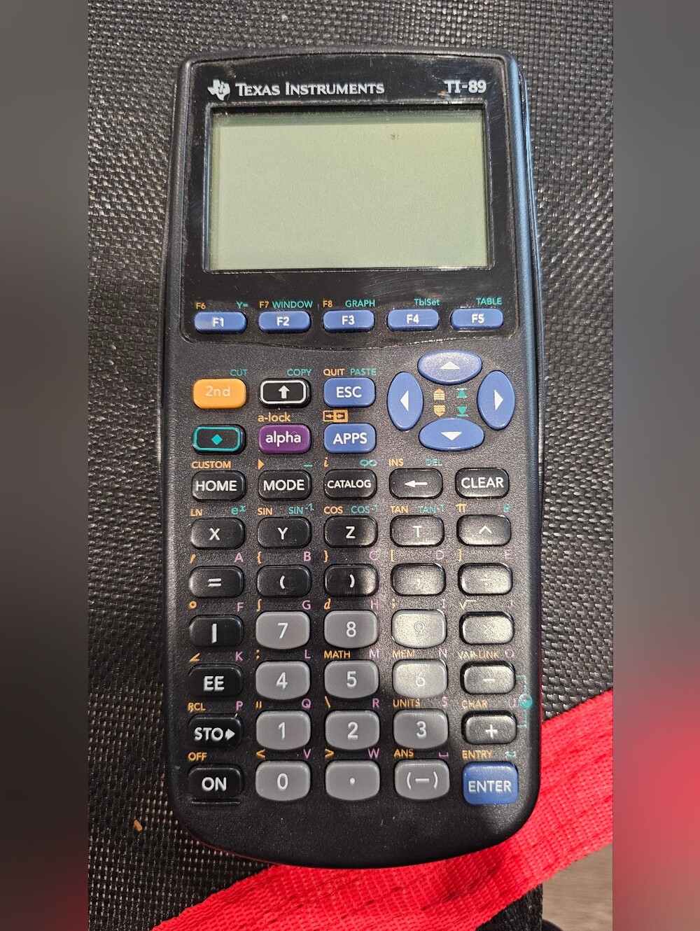 Texas Instruments Black Graphing Calculator with Blue Navigation Keys